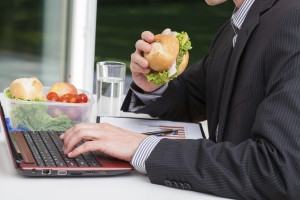 Worker eating at his desk