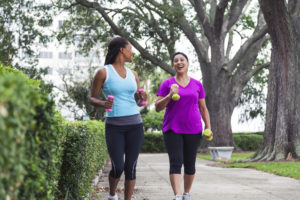 Women exercising in park