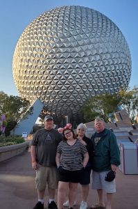 During a 2019 spring break trip to Disney with his family, John Cook (far right), was suffering from so much knee pain that he had to rent a power chair for a portion of the trip. But after a successful knee replacement with Dr. Scott Smith at Riverview Health in 2020, John says he is looking forward to traveling again without pain. 