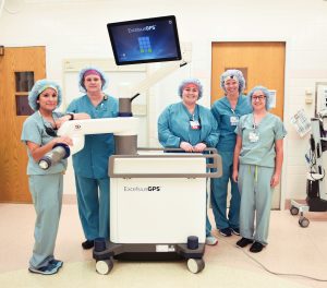 Riverview Health surgical staff poses with the new ExcelsiusGPS robot. Riverview Health is the first hospital in Indiana to offer this technology.